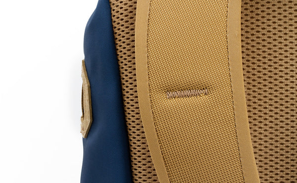 A close shot of the bartacking on the shoulder strap on the Guide's Pack.